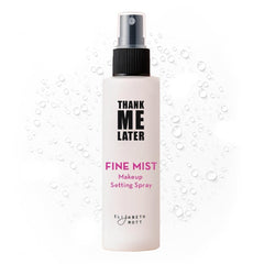 Elizabeth Mott Thank Me Later setting spray being misted for long-lasting wear and glow.