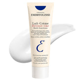 Embryolisse Lait-Crème bottle in hand for daily hydration and gentle anti-aging support.