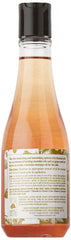 Close-up of Eminence Apricot Body Oil smoothing skin texture.