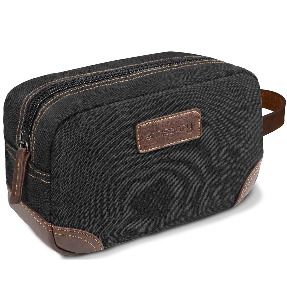 Emissary men's toiletry bag front view highlights leather and canvas durability for travel.