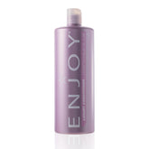 Enjoy Luxury Conditioner bottle showing frizz control for smoother hair.
