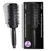ERGO Ceramic Ionic Round Brush barrel closeup highlights tourmaline ceramic for frizz control.