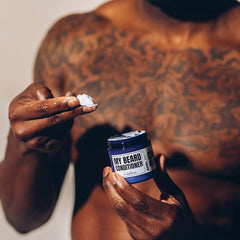 Evan Alexander Grooming beard conditioner texture closeup shows smoothing application.
