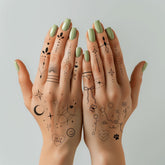Everjoy minimalist tattoo flower doodles on finger for delicate everyday chic look.