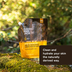 Every Man Jack Amber Sandalwood bottle label closeup, paraben-free and dye-free cues.