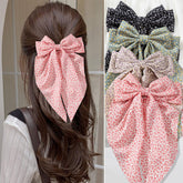 FDBJulyy bow clips pack-shot showing four black satin clips for secure styling