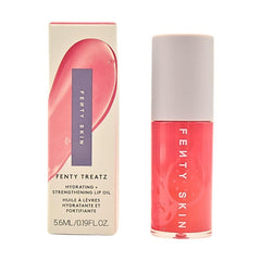 Fenty Skin Fenty Treatz Lip Oil Dragon Fruit bottle glows with hydrating shine.