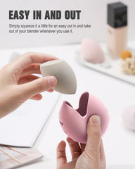 FERYES makeup sponge holder pink lid open highlights easy access and ventilation for drying.