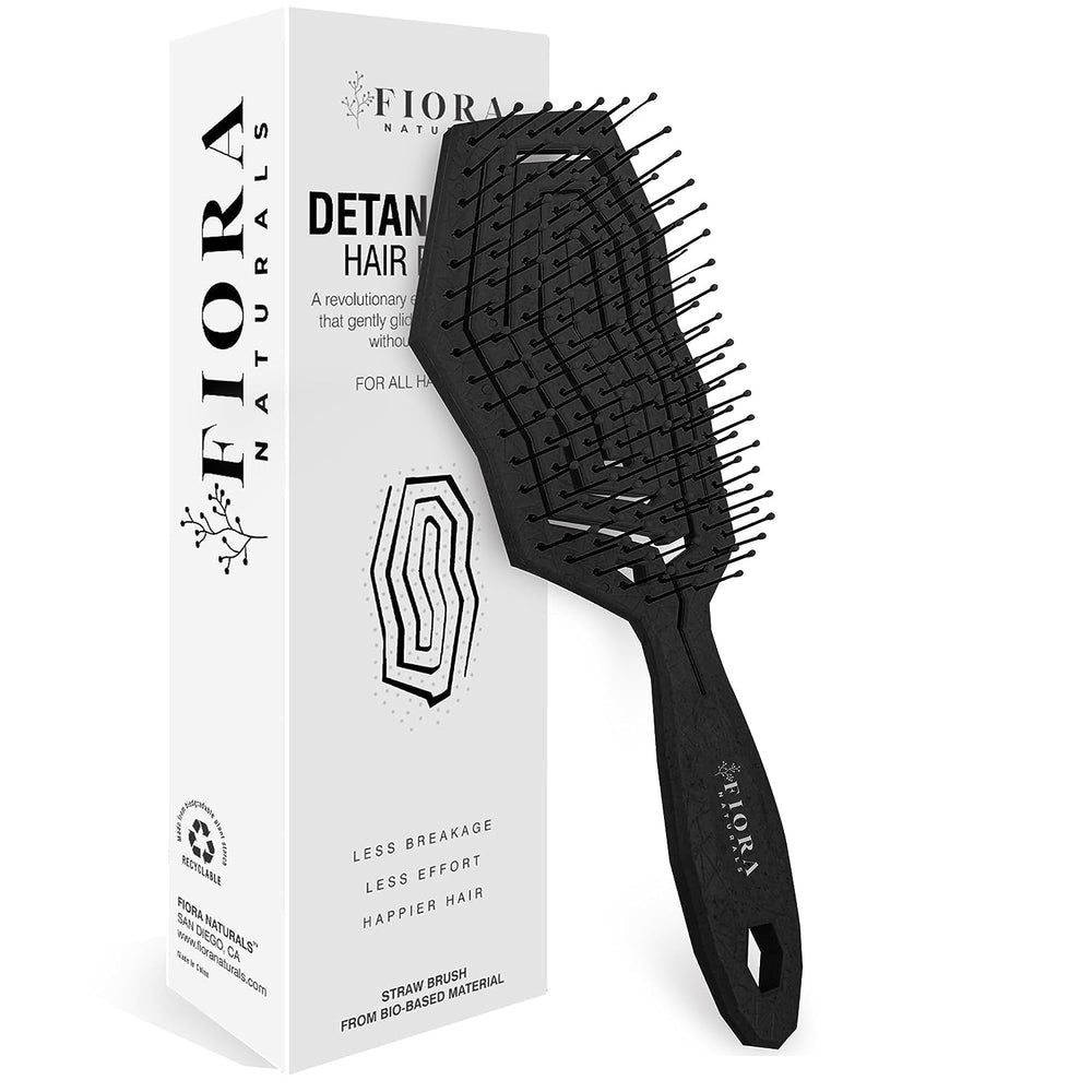 Fiora Naturals detangling brush front view with ergonomic handle for comfortable grip.