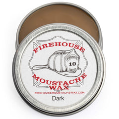 Firehouse Moustache Wax dark tin close-up shows natural color and strong hold.
