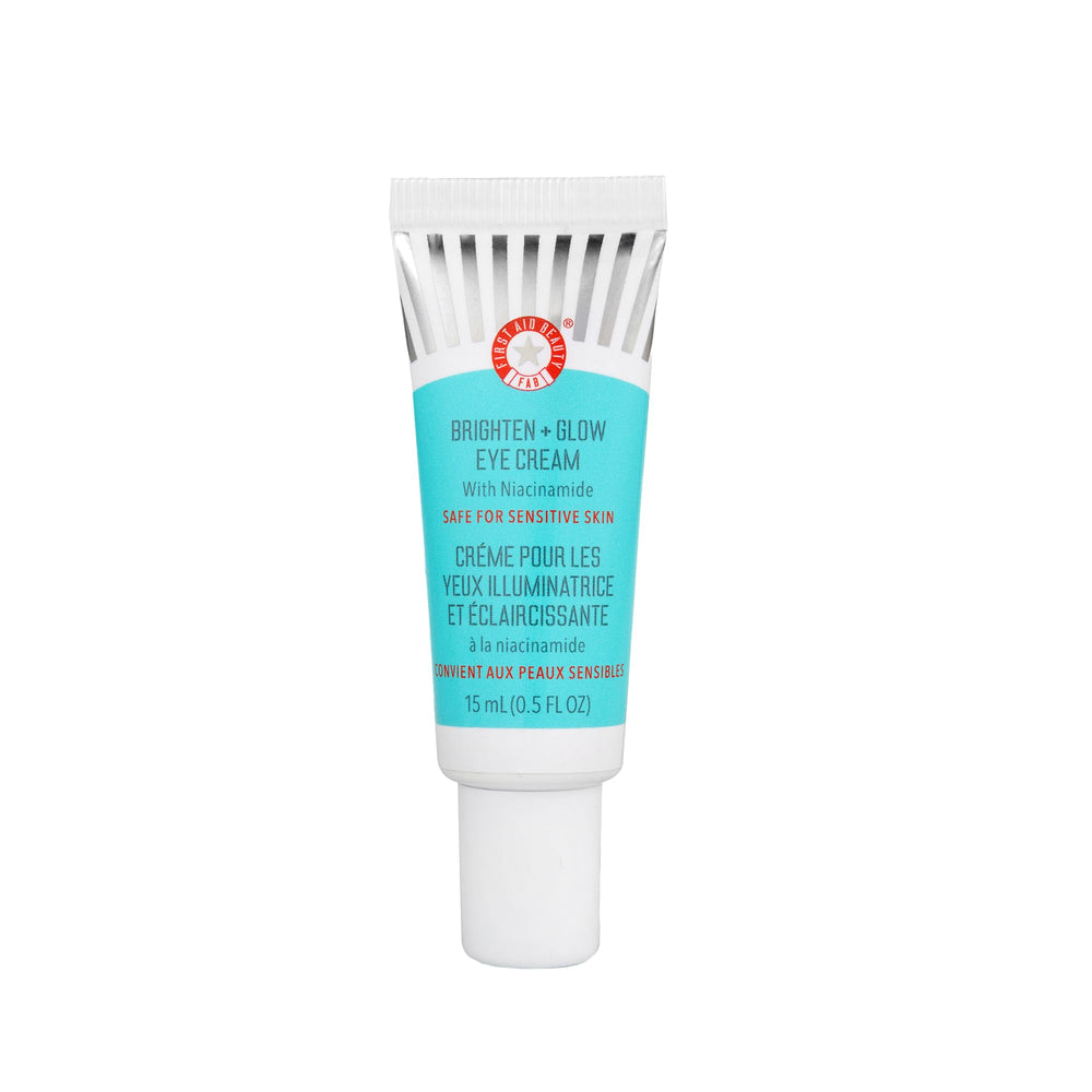 First Aid Beauty Brighten Glow Eye Cream tube application showing instant glow and hydration