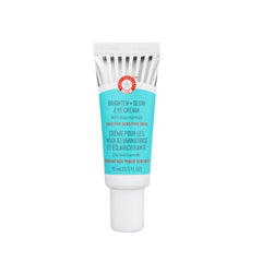 First Aid Beauty Brighten Glow Eye Cream tube application showing instant glow and hydration