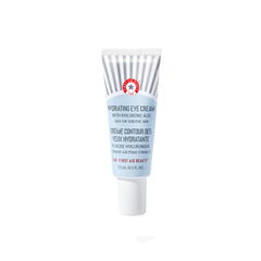 First Aid Beauty Hydrating Eye Cream tube close-up showing creamy texture for gentle nourishing application