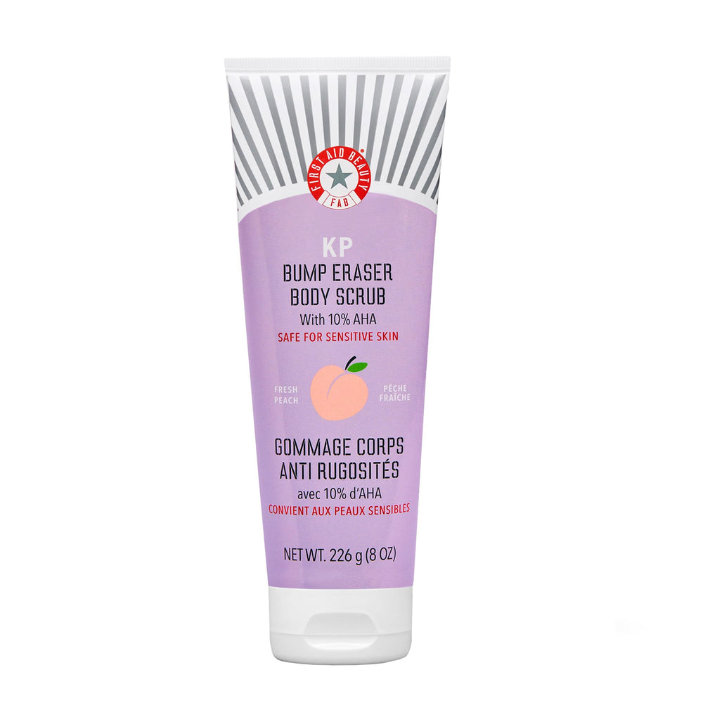 First Aid Beauty KP Bump Eraser bottle close-up showing peach scent for smoother skin.