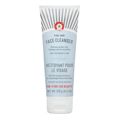 First Aid Beauty Pure Skin Cleanser bottle demonstrates fragrance-free makeup removal for sensitive skin.