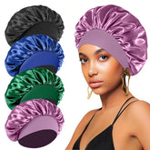 FIRSTPELLA silk satin bonnet in black protects curls overnight.