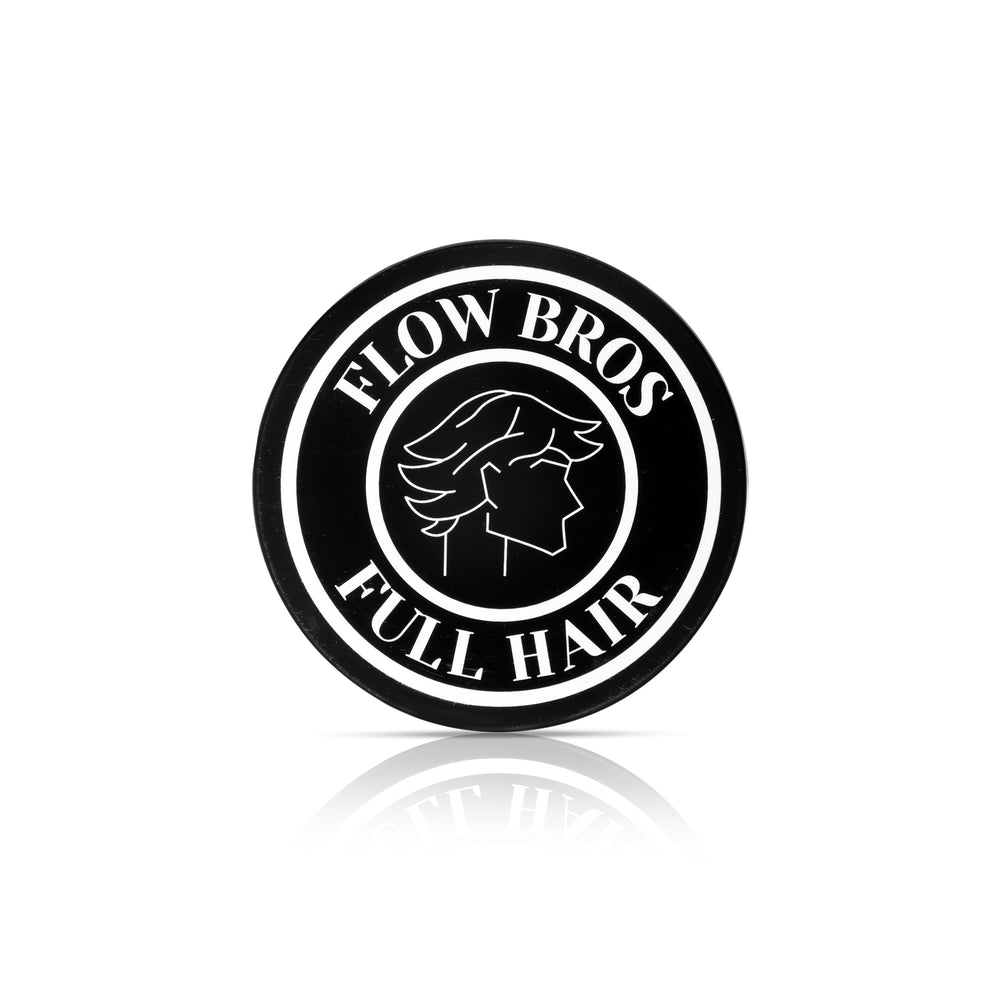Flow Bros hair clay bottle shows nourishing formula for healthy-looking hair.