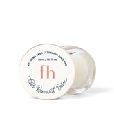 FlutterHabit Lash Removal Balm tube closeup demonstrates residue-free, gentle lash removal.