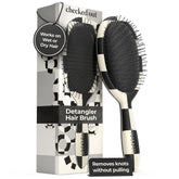 FRAMAR checkered-print hair brush eases tangles on dry hair.