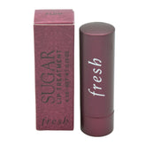 Fresh Sugar Lip Treatment Plum tube closeup shows smooth, hydrating tint for daily wear.