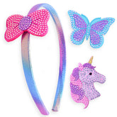FROG SAC charm headband with unicorn clip enhances playful outfit and keeps hair in place.