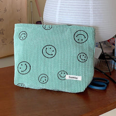 Gardsell corduroy cosmetic bag side view showing compact storage options.