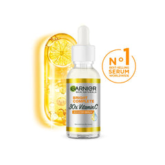 Garnier Bright Complete Vitamin C Booster applying dots on face for an even complexion