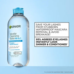 Garnier micellar pad held to closed eye to remove waterproof makeup gently