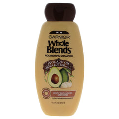 Garnier Whole Blends avocado-oil shampoo bottle for nourished hair and gentle cleansing.