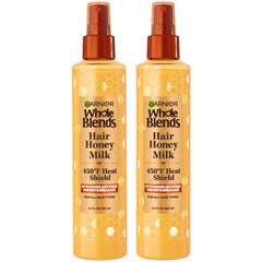 Garnier Whole Blends Hair Honey Milk heat-protectant spray bottle provides 450F protection for all hair types.