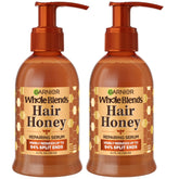 Garnier Whole Blends Honey Treasures serum bottle close-up showing non-greasy repair