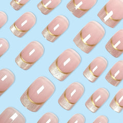Generic French nails with gold stripes for chic dressy style.