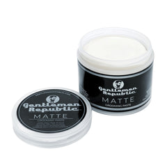 Gentlemen Republic logo on hands applying paste for flexible, non-greasy styling.