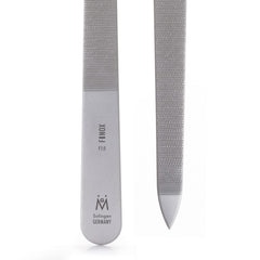 GERMANIKURE triple cut nail file hands holding demonstrates precise shaping