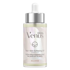Gillette Venus Softening Oil bottle showing plant-based formula for skin and hair hydration.
