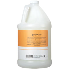 Ginger Lily Farms conditioner dispensing scene highlights eco-friendly gallon refill option for salons.