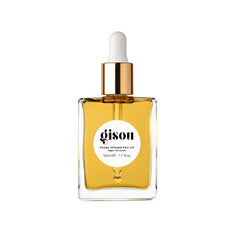 Gisou Honey Infused Hair Oil bottle pour demonstrates hydrating luxury for frizz control.