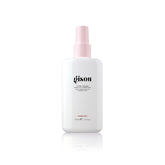 Gisou Honey Infused Leave-In Conditioner bottle on vanity for detangling and shine.