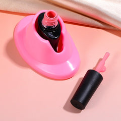 Gjinxi nail-polish-bottle-base-anti-spill-white keeps bottles upright for clean, precise application.