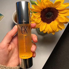 GK HAIR Oil on hand demonstrates quick absorption with non-greasy finish.