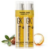 GK HAIR travel-size hair oil bottle pour for lightweight hydration and frizz control.