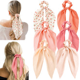 Glaudmeiss cherry-pink bow silk scrunchie with knot bow for versatile everyday styling.