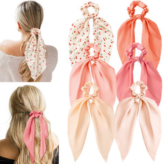 Glaudmeiss cherry-pink bow silk scrunchie with knot bow for versatile everyday styling.