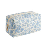Gleyemor small quilted makeup bag in blue floral, front view, ideal for organizing essentials.