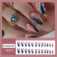Gold Foil Blue Marble nails feature a mirror finish for a polished shimmer.