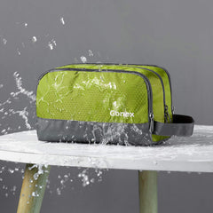 Gonex travel toiletry bag green side handle for easy carrying on trips.