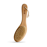 Goop Beauty Dry Brush with wooden handle for easy exfoliation