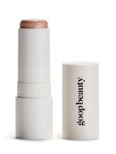 goop Beauty Glow Skin Highlighter Stick on application shows pearlescent glow for radiant skin.