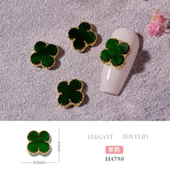 Green Clover nail charms on-nail detail showing rhinestone edge.