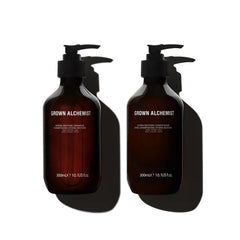 Grown Alchemist Hydra-Restore Shampoo bottle pour showing lightweight cleansing for hydrated, shiny hair.